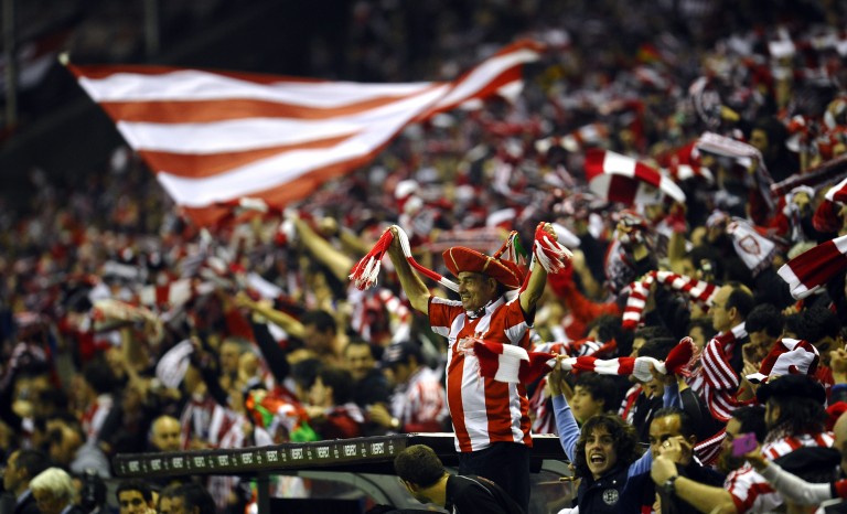 Athletic Bilbao's supporters celebrate as their team won 6-2 against Manchester United's, during their Europa League second leg, round of 16 soccer match at the San Mames stadium in Bilbao, northern Spain, Thursday, March 15, 2012. (AP Photo/Juan Manuel Serrano Arce)